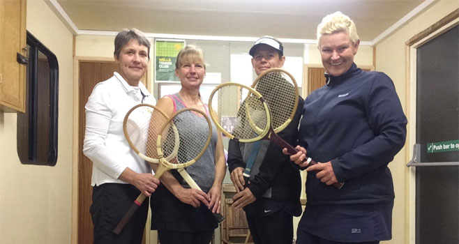 Wells Ladies A team, Caroline, Wendy, Marie and Julia (captain) posing with traditional wooden rackets.