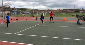Wells Tennis Club Open Day 2017 Children playing on a court with coach Kevin Durney